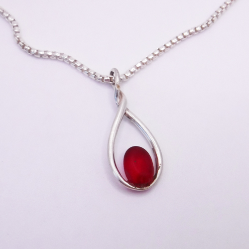 red sea glass necklace in a unique bezel setting