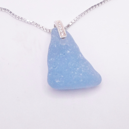 cornflower blue sea glass necklace with a cz bail on top