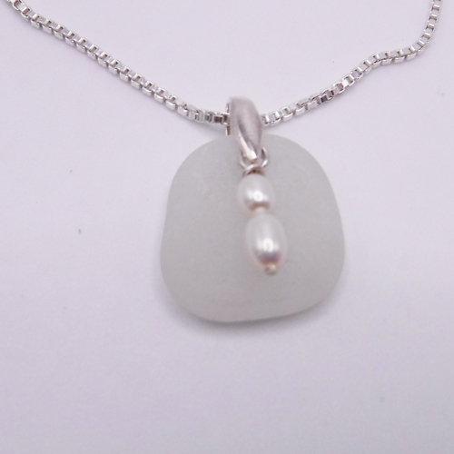White sea glass necklace with fresh water pearls make up this pretty necklace